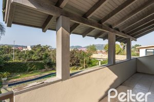 Casa em Condomínio à venda com 450m², 3 dormitórios, 1 suíte, 6 vagas, no bairro Cavalhada em PORTO ALEGRE