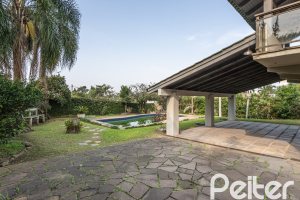 Casa em Condomínio à venda com 450m², 3 dormitórios, 1 suíte, 6 vagas, no bairro Cavalhada em PORTO ALEGRE