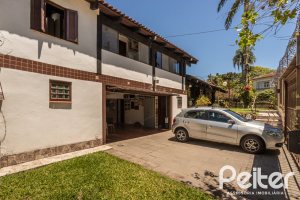 Casa à venda com 350m², 3 dormitórios, 1 suíte, 6 vagas, no bairro Jardim Isabel em Porto Alegre