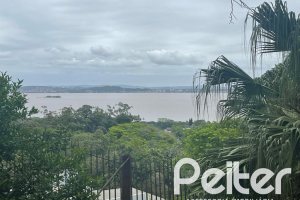 Casa à venda com 397m², 4 dormitórios, 1 suíte, 4 vagas, no bairro Sétimo Céu em Porto Alegre