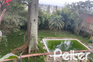 Casa à venda com 397m², 4 dormitórios, 1 suíte, 4 vagas, no bairro Sétimo Céu em Porto Alegre