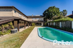 Casa em Condomínio à venda com 545m², 3 dormitórios, 3 suítes, 6 vagas, no bairro Cavalhada em PORTO ALEGRE
