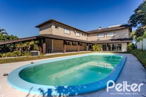Casa em Condomínio à venda com 545m², 3 dormitórios, 3 suítes, 6 vagas, no bairro Cavalhada em PORTO ALEGRE