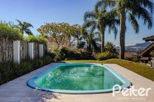 Casa em Condomínio à venda com 545m², 3 dormitórios, 3 suítes, 6 vagas, no bairro Cavalhada em PORTO ALEGRE