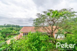 Casa em Condomínio à venda com 400m², 3 dormitórios, 1 suíte, 5 vagas, no bairro Campo Novo em Porto Alegre