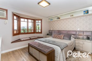 Casa em Condomínio à venda com 249m², 3 dormitórios, 1 suíte, 3 vagas, no bairro Vila Assunção em Porto Alegre