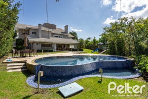 Casa em Condomínio à venda com 587m², 4 dormitórios, 4 suítes, 6 vagas, no bairro Terra Ville em PORTO ALEGRE