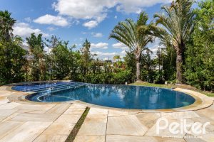 Casa em Condomínio à venda com 587m², 4 dormitórios, 4 suítes, 6 vagas, no bairro Terra Ville em PORTO ALEGRE