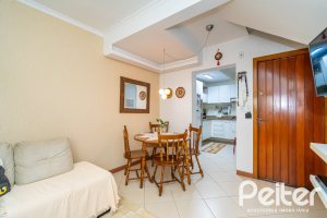 Casa em Condomínio à venda com 102m², 2 dormitórios, 1 suíte, 1 vaga, no bairro Guarujá em Porto Alegre