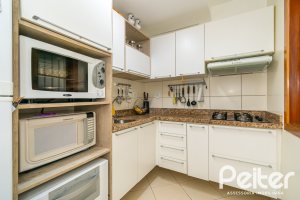 Casa em Condomínio à venda com 102m², 2 dormitórios, 1 suíte, 1 vaga, no bairro Guarujá em Porto Alegre