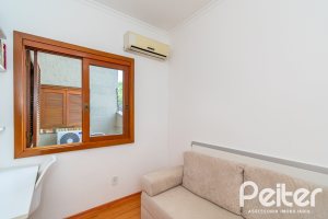 Casa em Condomínio à venda com 102m², 2 dormitórios, 1 suíte, 1 vaga, no bairro Guarujá em Porto Alegre