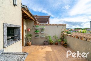 Casa em Condomínio à venda com 102m², 2 dormitórios, 1 suíte, 1 vaga, no bairro Guarujá em Porto Alegre