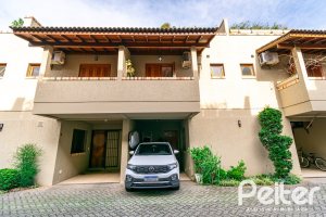 Casa em Condomínio à venda com 102m², 2 dormitórios, 1 suíte, 1 vaga, no bairro Guarujá em Porto Alegre