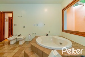 Casa em Condomínio à venda com 388m², 3 dormitórios, 2 suítes, 6 vagas, no bairro Cavalhada em PORTO ALEGRE