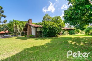 Casa em Condomínio à venda com 388m², 3 dormitórios, 2 suítes, 6 vagas, no bairro Cavalhada em PORTO ALEGRE