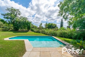 Casa em Condomínio à venda com 388m², 3 dormitórios, 2 suítes, 6 vagas, no bairro Cavalhada em PORTO ALEGRE