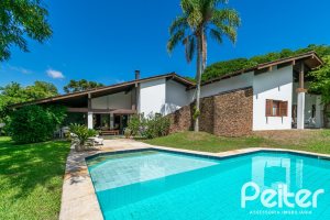 Casa em Condomínio à venda com 388m², 3 dormitórios, 2 suítes, 6 vagas, no bairro Cavalhada em PORTO ALEGRE