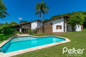 Casa em Condomínio à venda com 388m², 3 dormitórios, 2 suítes, 6 vagas, no bairro Cavalhada em PORTO ALEGRE