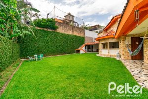 Casa em Condomínio à venda com 390m², 4 dormitórios, 3 suítes, 9 vagas, no bairro Nonoai em Porto Alegre