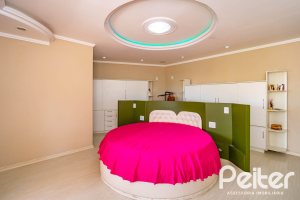 Casa em Condomínio à venda com 390m², 4 dormitórios, 3 suítes, 9 vagas, no bairro Nonoai em Porto Alegre