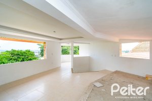 Casa em Condomínio à venda com 390m², 4 dormitórios, 3 suítes, 9 vagas, no bairro Nonoai em Porto Alegre