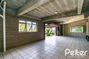 Casa em Condomínio à venda com 390m², 4 dormitórios, 3 suítes, 9 vagas, no bairro Nonoai em Porto Alegre