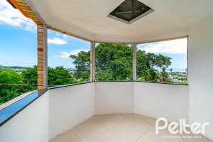 Casa em Condomínio à venda com 390m², 4 dormitórios, 3 suítes, 9 vagas, no bairro Nonoai em Porto Alegre