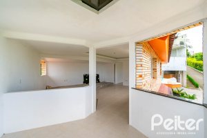 Casa em Condomínio à venda com 390m², 4 dormitórios, 3 suítes, 9 vagas, no bairro Nonoai em Porto Alegre