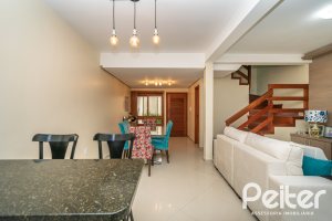 Casa em Condomínio à venda com 133m², 3 dormitórios, 1 suíte, 2 vagas, no bairro Tristeza em Porto Alegre