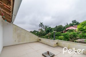 Casa em Condomínio à venda com 133m², 3 dormitórios, 1 suíte, 2 vagas, no bairro Tristeza em Porto Alegre