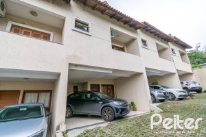 Casa em Condomínio à venda com 133m², 3 dormitórios, 1 suíte, 2 vagas, no bairro Tristeza em Porto Alegre