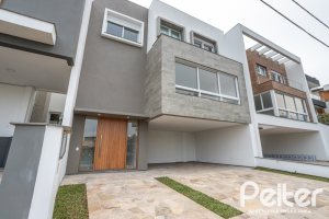 Casa em Condomínio à venda com 254m², 3 dormitórios, 3 suítes, 2 vagas, no bairro Hipica em PORTO ALEGRE