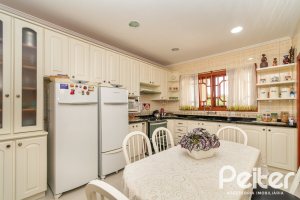 Casa em Condomínio à venda com 477m², 3 dormitórios, 1 suíte, 3 vagas, no bairro Nonoai em Porto Alegre