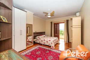 Casa em Condomínio à venda com 477m², 3 dormitórios, 1 suíte, 3 vagas, no bairro Nonoai em Porto Alegre