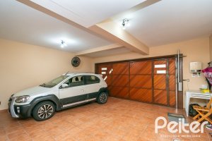 Casa em Condomínio à venda com 477m², 3 dormitórios, 1 suíte, 3 vagas, no bairro Nonoai em Porto Alegre