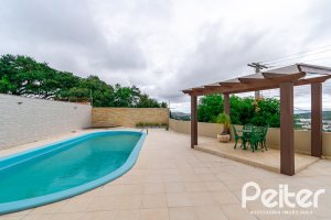 Casa em Condomínio à venda com 477m², 3 dormitórios, 1 suíte, 3 vagas, no bairro Nonoai em Porto Alegre