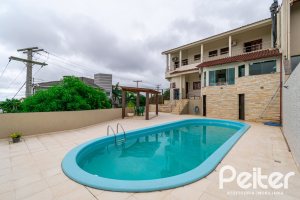 Casa em Condomínio à venda com 477m², 3 dormitórios, 1 suíte, 3 vagas, no bairro Nonoai em Porto Alegre