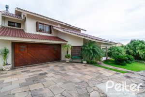 Casa em Condomínio à venda com 477m², 3 dormitórios, 1 suíte, 3 vagas, no bairro Nonoai em Porto Alegre