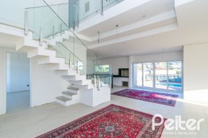 Casa em Condomínio à venda com 345m², 3 dormitórios, 3 suítes, 4 vagas, no bairro Alphaville em PORTO ALEGRE