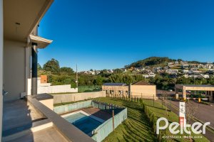 Casa em Condomínio à venda com 345m², 3 dormitórios, 3 suítes, 4 vagas, no bairro Alphaville em PORTO ALEGRE