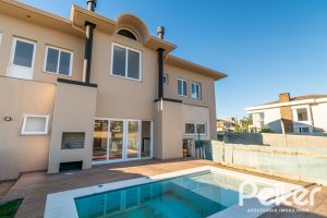 Casa em Condomínio à venda com 345m², 3 dormitórios, 3 suítes, 4 vagas, no bairro Alphaville em PORTO ALEGRE