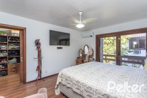 Casa em Condomínio à venda com 701m², 6 dormitórios, 2 suítes, 10 vagas, no bairro Cavalhada em PORTO ALEGRE