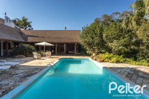 Casa em Condomínio à venda com 701m², 6 dormitórios, 2 suítes, 10 vagas, no bairro Cavalhada em PORTO ALEGRE