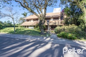 Casa em Condomínio à venda com 701m², 6 dormitórios, 2 suítes, 10 vagas, no bairro Cavalhada em PORTO ALEGRE