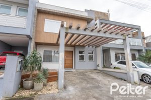 Casa em Condomínio à venda com 136m², 3 dormitórios, 1 suíte, 2 vagas, no bairro Hípica em Porto Alegre