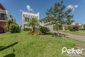 Casa em Condomínio à venda com 270m², 3 dormitórios, 2 suítes, 3 vagas, no bairro Terra Ville em PORTO ALEGRE