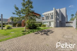Casa em Condomínio à venda com 270m², 3 dormitórios, 2 suítes, 3 vagas, no bairro Terra Ville em PORTO ALEGRE