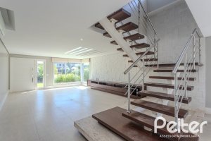 Casa em Condomínio à venda com 270m², 3 dormitórios, 2 suítes, 3 vagas, no bairro Terra Ville em PORTO ALEGRE