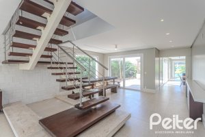 Casa em Condomínio à venda com 270m², 3 dormitórios, 2 suítes, 3 vagas, no bairro Terra Ville em PORTO ALEGRE