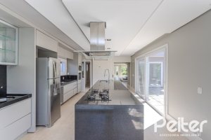Casa em Condomínio à venda com 270m², 3 dormitórios, 2 suítes, 3 vagas, no bairro Terra Ville em PORTO ALEGRE